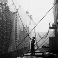 Man cleaning ship, dockworkers, NYC, 1947